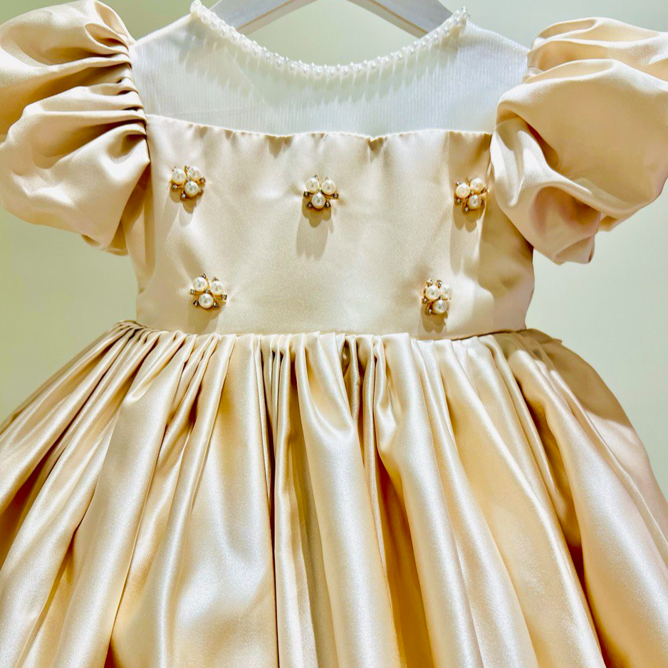 Elegant Champagne Satin Dress with Puffy Sleeves and Pearl Embellishments