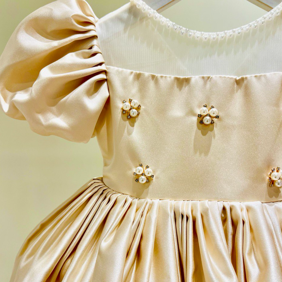 Elegant Champagne Satin Dress with Puffy Sleeves and Pearl Embellishments